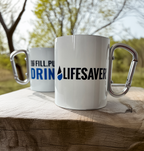 Two mugs with carabiner handles on a wooden surface outdoors.