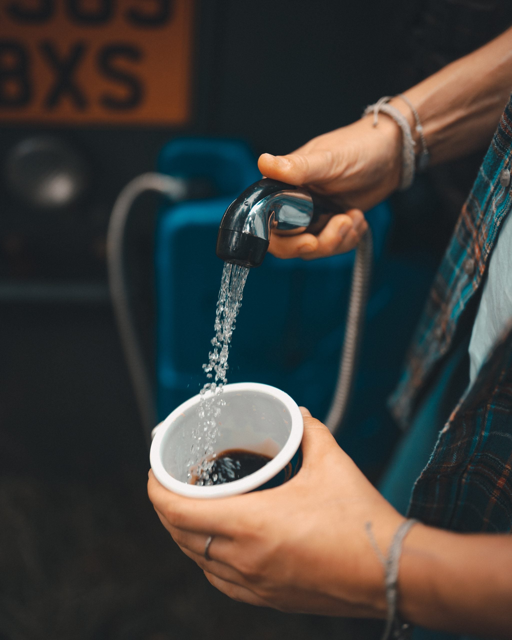 Rinsing a dirty cup with purified water